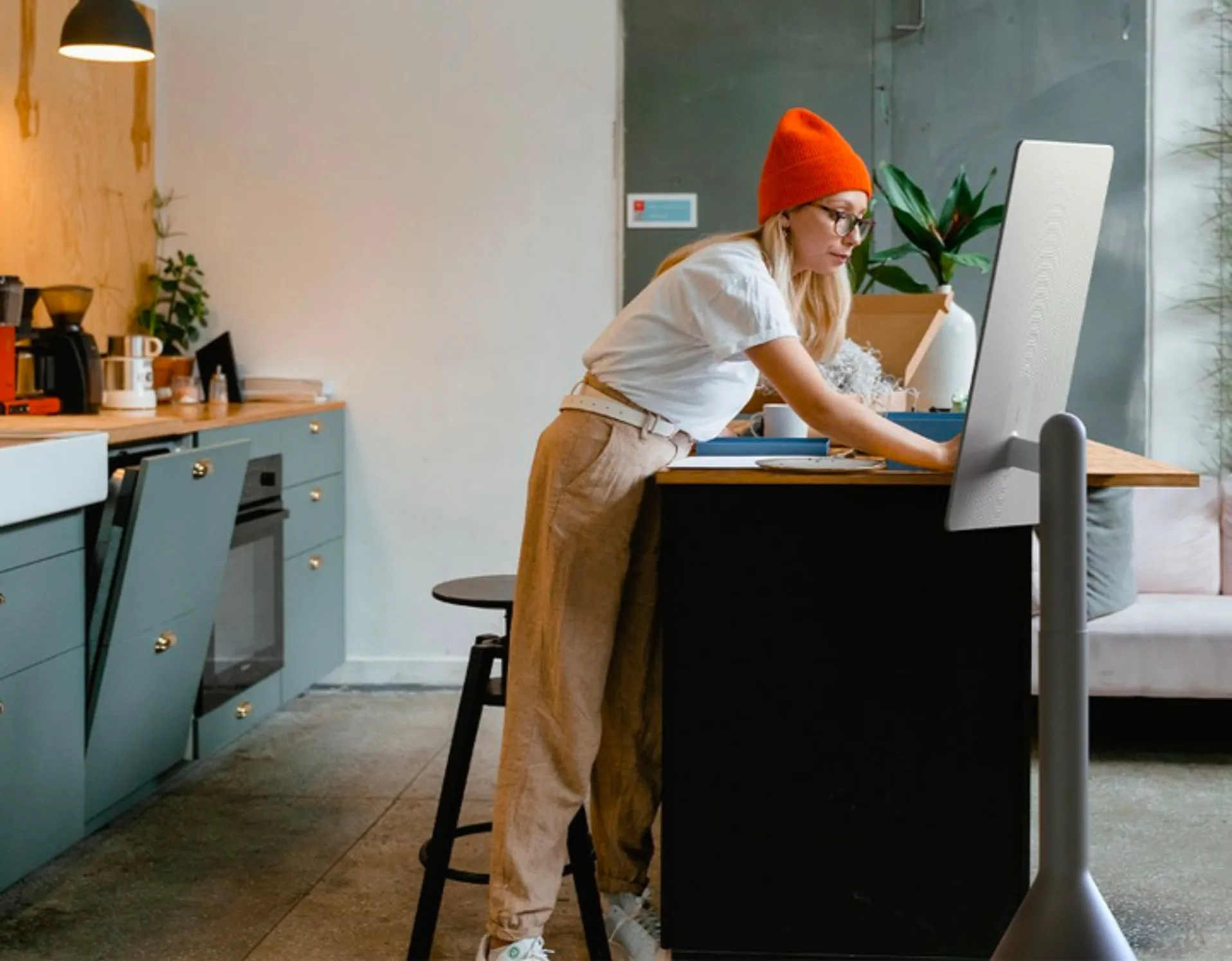 Woman working at the kitchen counter with OLED Glow